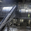 Conveyor belt transporting material inside Stena Nordic Recycling Center
